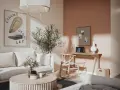 Ett inrett litet rum med en bekväm soffa, ett runt soffbord med blommor och en arbetsplats vid ett fönster.