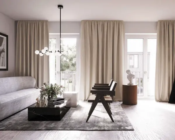 Ett elegant vardagsrum med skandinavisk inredning. En ljus soffa, marmorbord och en unik golvlampa skapar en stilfull atmosfär.